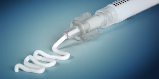 Picture of syringe with NANOGEL® and blue gradient background